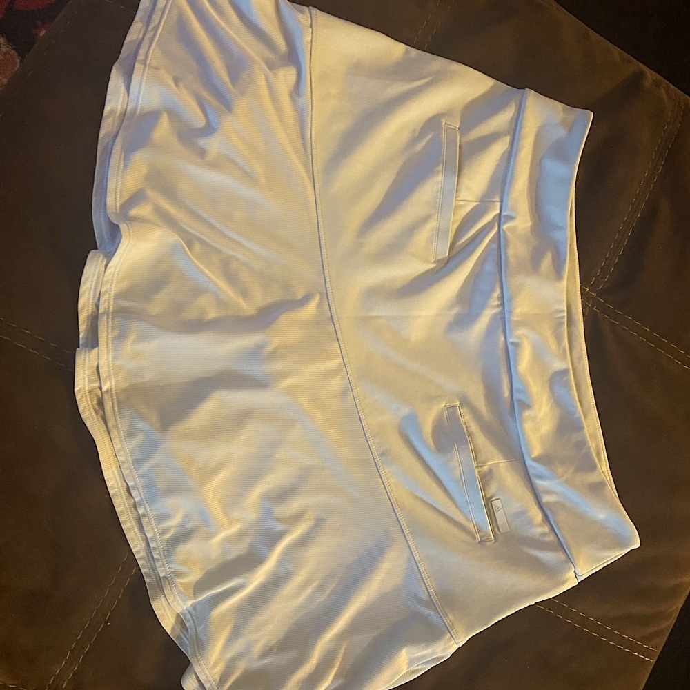 Adidas baby blue golf skirt.  New without tags.  Super cute ruffle skirt.